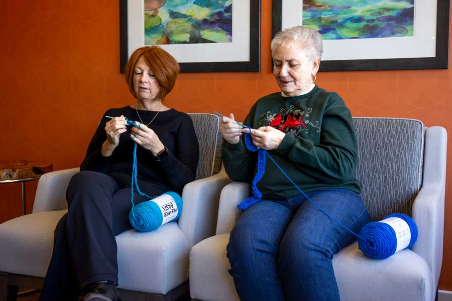 two people knitting